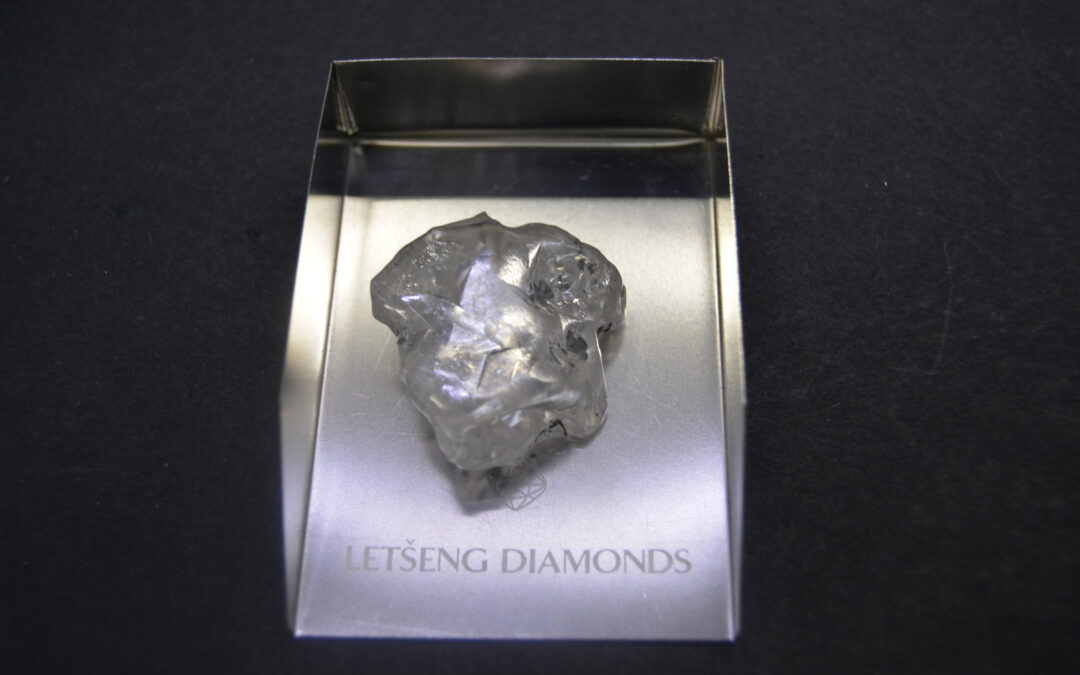 Photo of large uncut diamond on display case