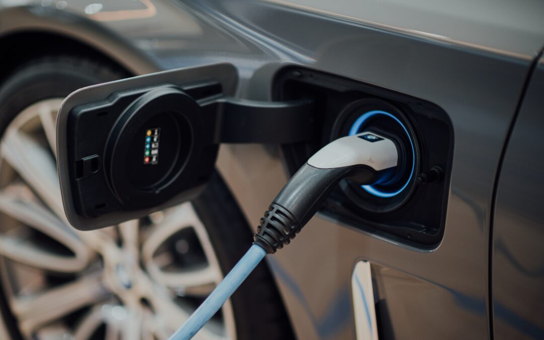 Electric car connected to charging port (photo)