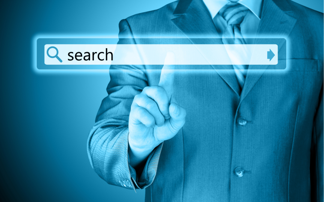Man in business suit pointing at a floating internet search bar which has the word 'search' with a magnifying glass on it.