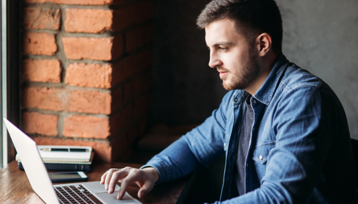 Young man working at a laptop