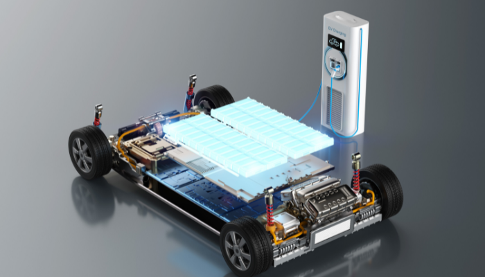 3d rendering of a transparent electric vehicle plugged into a power charging point, with the EV battery visible